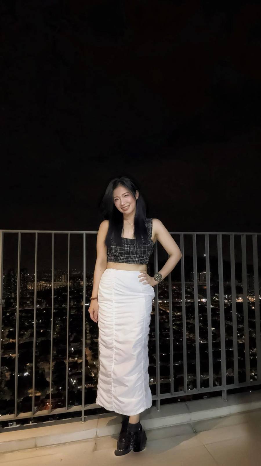 Pauline Tan on a balcony.